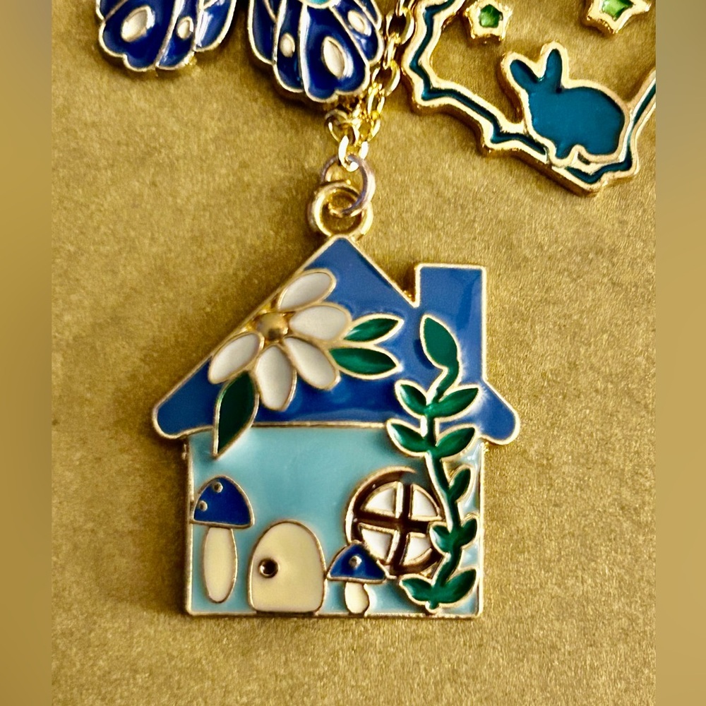 NWOT Necklace Alice in Wonderland, blue enamel charms rabbit, flower, cat… 21” - Picture 3 of 6